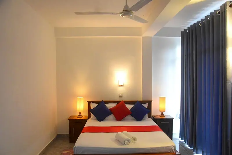 Double room in the evening with lamps lit