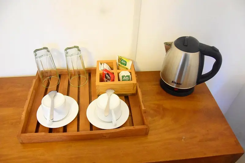 Tea tray with cups and a selection of teas